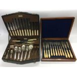 A collection of silver plated cutlery sets.