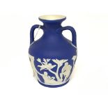 A 19th century Wedgwood model of the Portland vase with raised decoration height 15cm no damage or