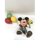 A modern, painted wooden Mickey Mouse with balloons model.