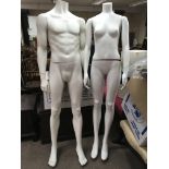 A pair of shop display mannequins, one male one female. Height approx 166cm.