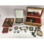 A collection of costume jewellery and other oddments including a gold Swastika pendant, two silver