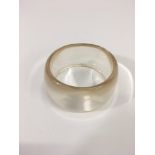 A wide, perspex bangle