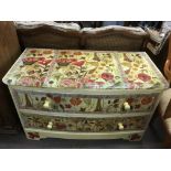 A chest of two drawers with yellow painted floral decoration. Approx 50x.96x55cm high - NO RESERVE