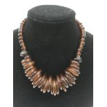 A recycled brown glass 'ring' necklace