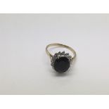 A 9ct gold ring set with a blue sapphire, approx 3.7g and approx size T.
