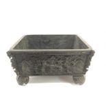A Chinese, bronze censer of rectangle shape having relief scrollwork decoration.Approx 9x12x7cm