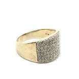 A 9ct gold ring, centre set with small diamonds.Approx W. 7.23g