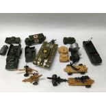 A Japanese tin plate toy tank together with other military toys including dinky