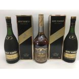 Two boxed bottles of Remy Martin Cognac plus a bottle of Martell Cognac (3).