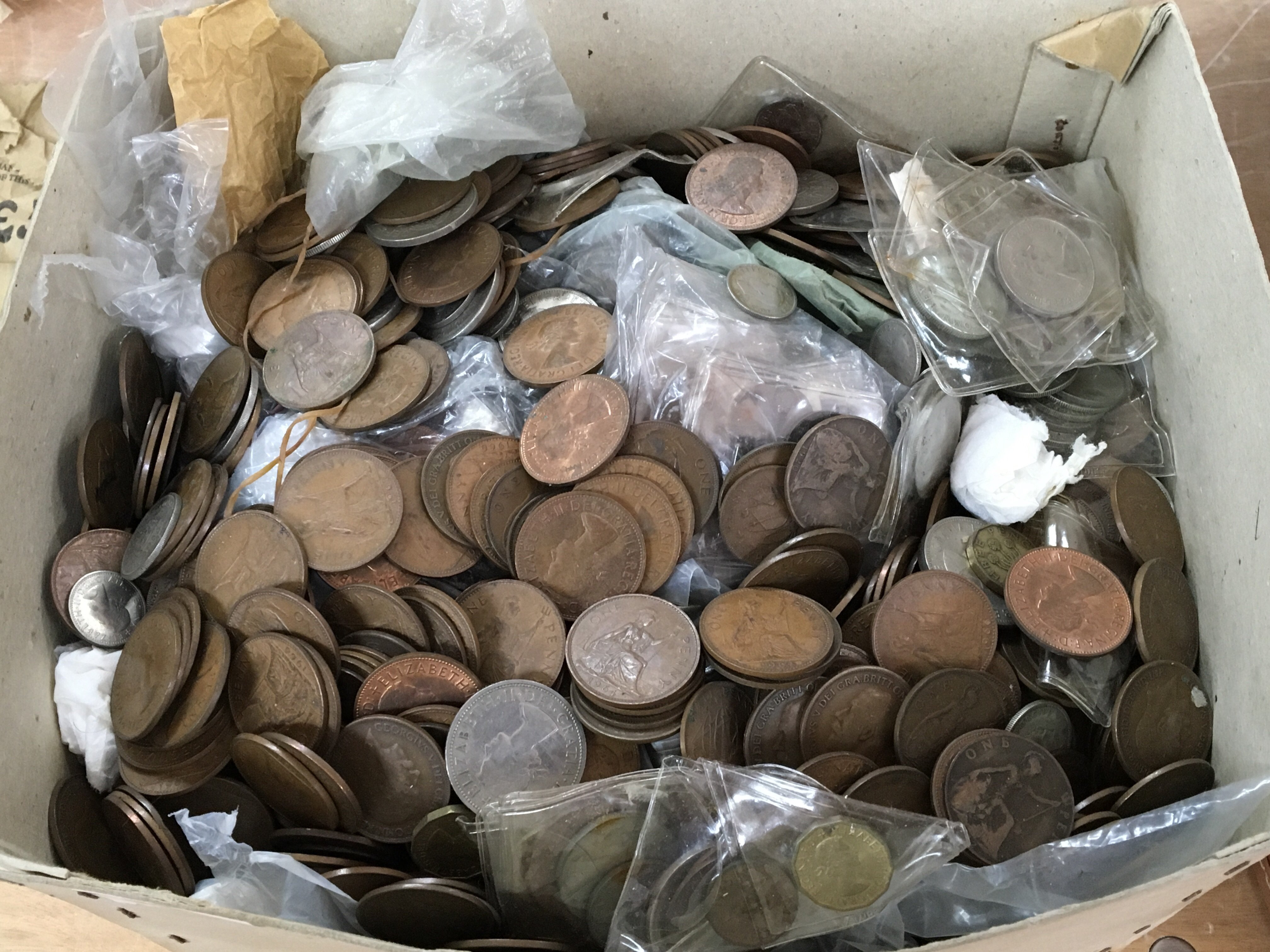 A box containing used circulated and Uncirculated British pre-decimal coins including some pre1946