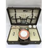 A vintage 1950's picnic set in a fitted case