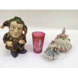 Two Dresden ladies. a Mary Gregory cranberry glass beaker and a character jug