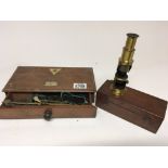 A set of brass beam balance scales maker C Stevens & Son in a Mahogany Case and a students