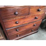A mahogany chest of drawers fitted with two short and three long drawers