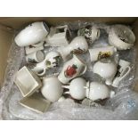 A box of crested ware including some Goss examples.