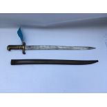 A large bayonet with a scale or feathered designed gilt, possibly American civil war. Blade length