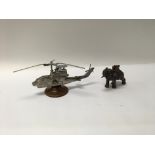 A pair of interesting table lighters, one in The form of a military helicopter and the other in