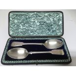 A cased pair of Victorian silver serving spoons, London FH hallmark.Approx 146g