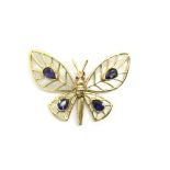 An articulated 18ct gold mother of pearl, tanzanite and ruby butterfly pendant by Simon Tilly of