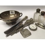 A collection of silver oddments a silver Vesta Case button hooks and a white metal bowl.