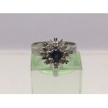 An 18ct white gold dress ring set with sapphires and diamonds, approx 4.4g and approx size M.