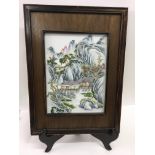 A framed, Chinese porcelain plaque painted with landscape scene .Approx 40x54cm