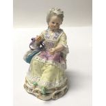 A Quality 19th Meissen figure of a seated lady in lace embodied dress. Height 12cm no restoration