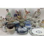 A collection of Victorian ceramics including jugs of various design, Staffordshire figures including