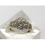 A 9ct gold and diamond raised cluster ring, marked 1.00.Approx W, 5.41g.