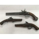 Three replica antique style pistols.