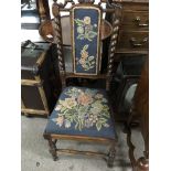 A Victorian walnut nursing chair with needle work back and seat on turned legs united by