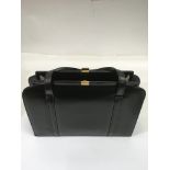 A vintage black leather handbag with suede interior.Approx 24x32cm