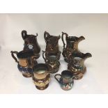 A group of 8 Victorian copper lustre jugs.