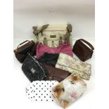 A collection of bags including vintage leather