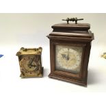 A small modern mahogany mantel clock and a 20th Century brass clock (2)