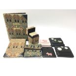 A Liberty of London playing card case containing two sets of playing cards, a Guests & Menus