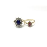 Two ladies 9ct gold and stone set rings, one with a central red stone surrounded by white stones and