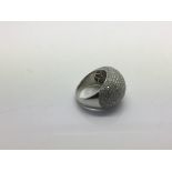 An 18ct white gold pave diamond dress ring, approx