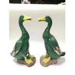 A pair of Chinese ceramic duck ornaments, decorated with green and yellow glaze height 30cm.