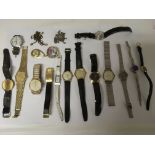 A small group of wristwatches and a Ola Gorie silver brooch