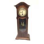 A Small desk top longcase clock with visible weights and pendulum. Height 26cm.