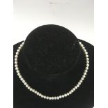 A single strand of pearls with 9ct gold clasp