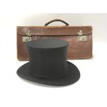 A leather Masonic collapsible case and a collapsible top hat made by Gaunson of London.