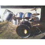 A Tama drumkit comprising bass drum, snare, floor tom, four rack toms, cymbals, hardware and
