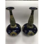A pair of Doulton vases with elongated necks over squat bodies, approx 39cm, one a/f.