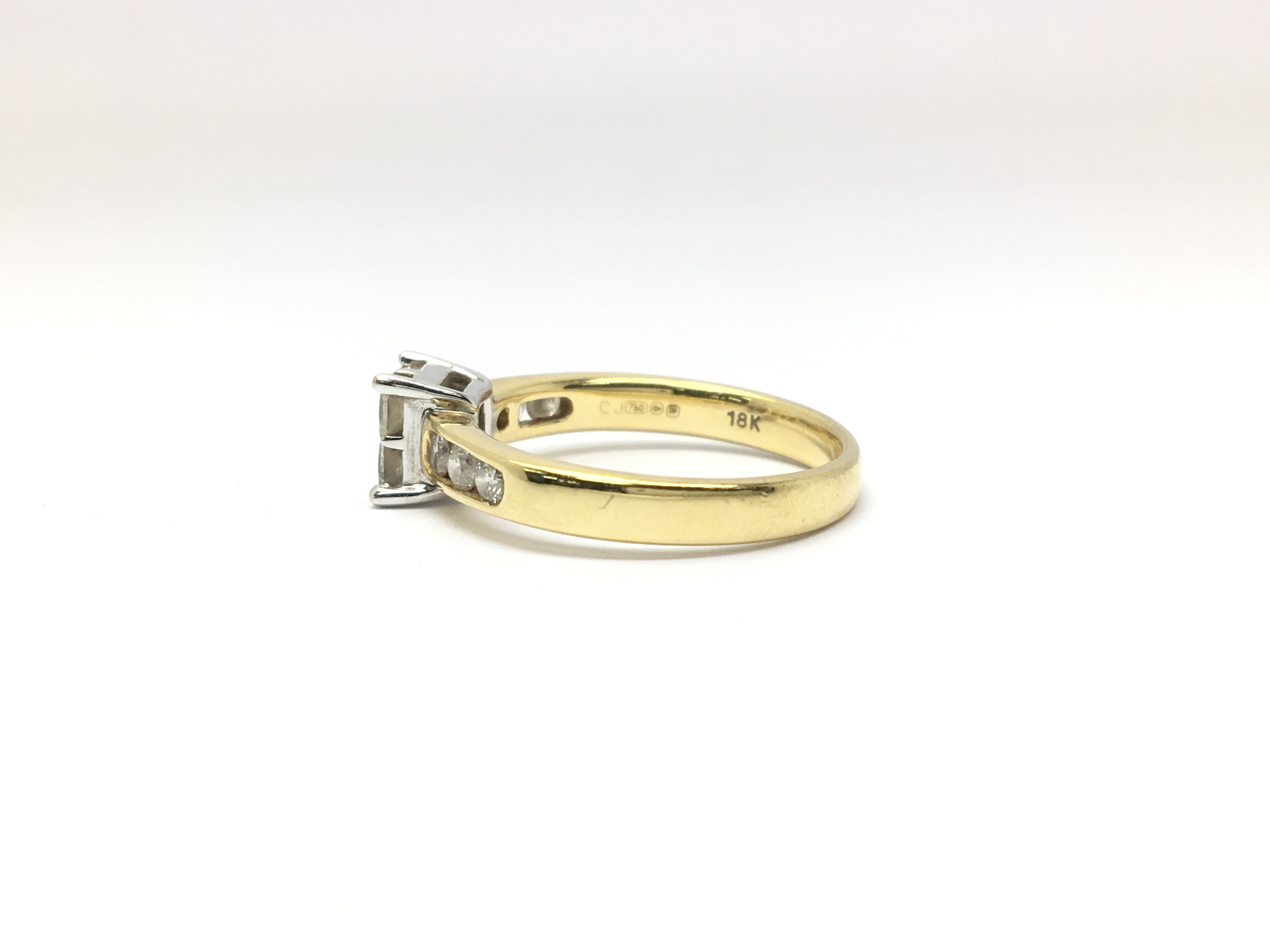 An 18ct yellow gold ring set with four central diamonds in a square formation, flanked either side - Image 2 of 3