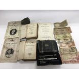 A collection of oddments including an 1815 book of Shakespeare, various old foreign bank notes,