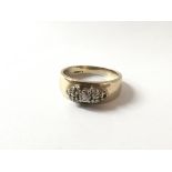 A 9ct gold diamond ring (one diamond missing)