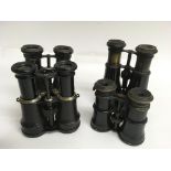 Four pairs of vintage binoculars including one pair with a compass