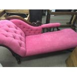 A Victorian mahogany chaise longue with pink butto